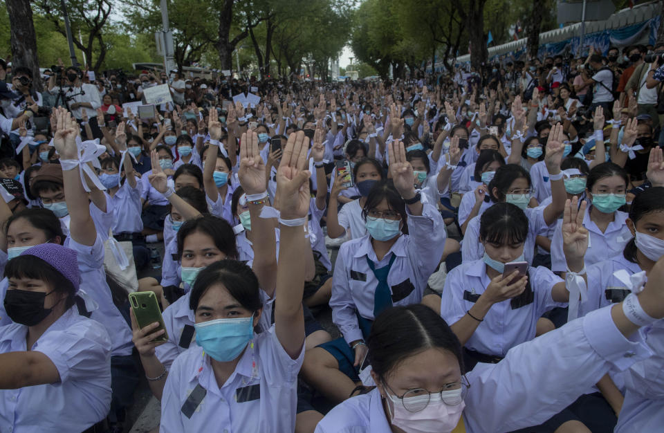 High school students salute with three-fingers, symbol of resistance during a protest rally in Bangkok, Thailand, Saturday, Sept. 5, 2020. The student's demonstration comes at a time of mass anti-government protests led predominantly by university students, putting added strain on the under-pressure administration of Prime Minister Prayuth Chan-ocha. (AP Photo/Gemunu Amarasinghe)