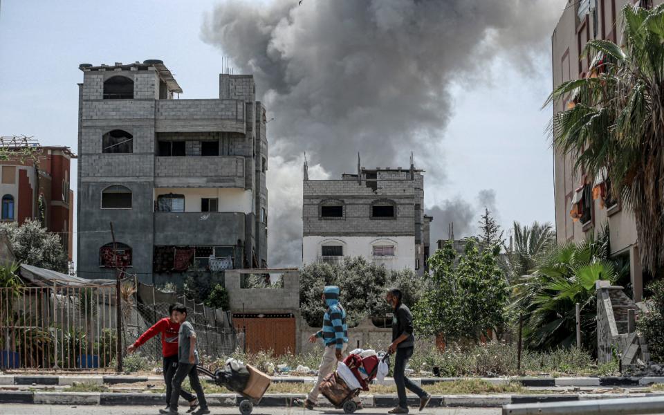 Smoke billows after an Israeli strike on a building in al-Bureij camp in the central Gaza Strip