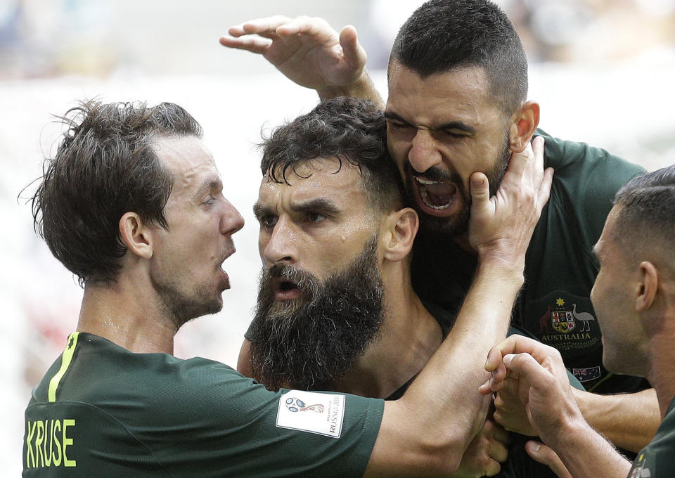 <p>Australia’s Mile Jedinak, centre, celebrates with teammates after scoring his side’s opening goal during the group C match between Denmark and Australia at the 2018 soccer World Cup in the Samara Arena in Samara, Russia, Thursday, June 21, 2018. (AP Photo/Gregorio Borgia) </p>