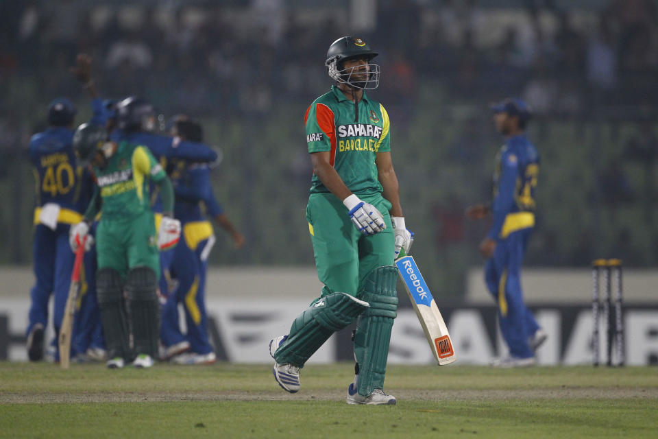 Bangladesh’s Shakib Al Hasan, center, walks back to the pavilion after his dismissal by Sri Lanka’s Ashan Priyanjan during their second one-day international (ODI) cricket match in Dhaka, Bangladesh, Thursday, Feb. 20, 2014. (AP Photo/A.M. Ahad)