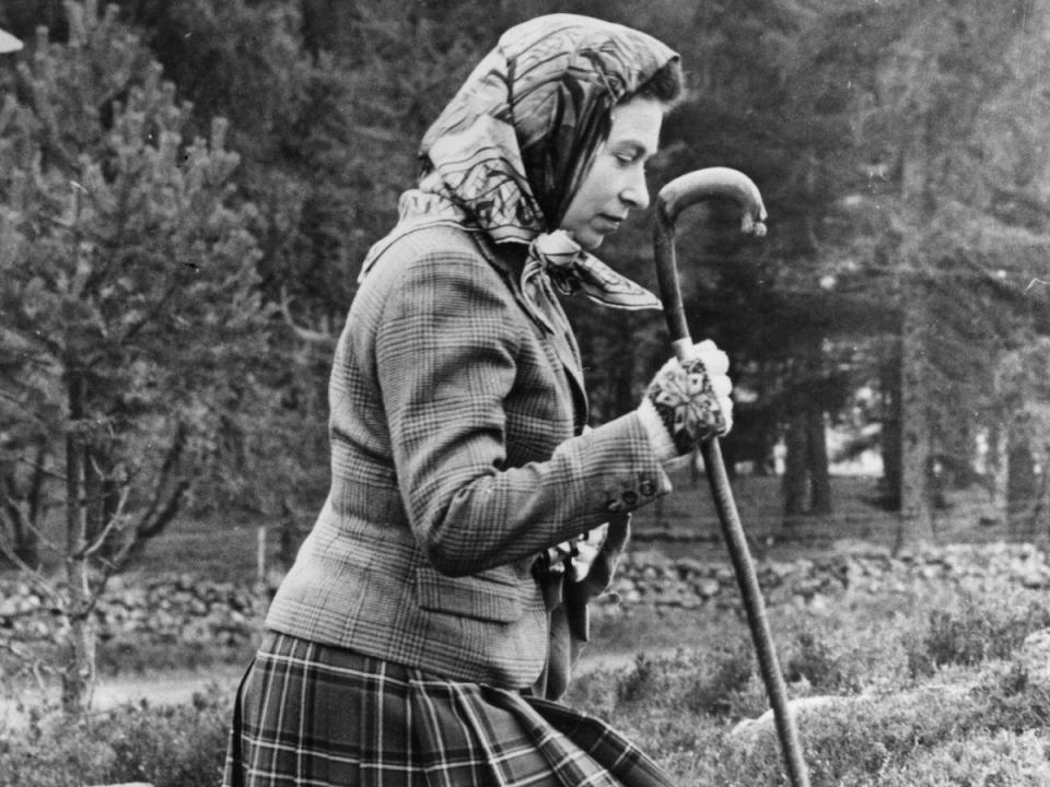 Queen Elizabeth II walking cross country  at the North of Scotland Gun Dog Association Open Stake Retriever Trials in the grounds of Balmoral Castle in 1967 (Getty)