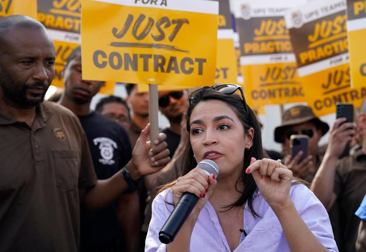 Prominent leaders including US Representative Alexandria Ocasio-Cortez threw their support behind UPS workers who threatened to strike but eventually struck a deal. (Photo by TIMOTHY A. CLARY / AFP) (Photo by TIMOTHY A. CLARY/AFP via Getty Images)