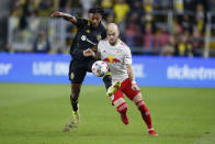 Columbus Crew's Steven Moreira, left, and New York Red Bulls' Andrew Gutman compete for position during the first half of an MLS soccer match Saturday, Oct. 23, 2021, in Columbus, Ohio. (AP Photo/Jay LaPrete)