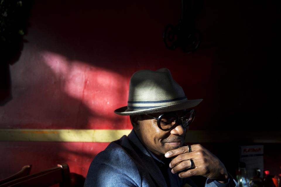 Xavier Bryant, 33, an independent pharmacy owner, sits at a restaurant while meeting a friend in East Atlanta, Ga., in Dekalb County, Thursday, Jan. 5, 2017. Bryant recalled Election Day as "a somber moment" and questions whether the incoming president can maintain a stable world order. He wonders, too, what Trump's often caustic approach on race, immigration and other matters means at home. "We can feed off a mob mentality" or "we can love one another," said Bryant. "That's the kind of rhetoric he needs to start bringing." (AP Photo/David Goldman)