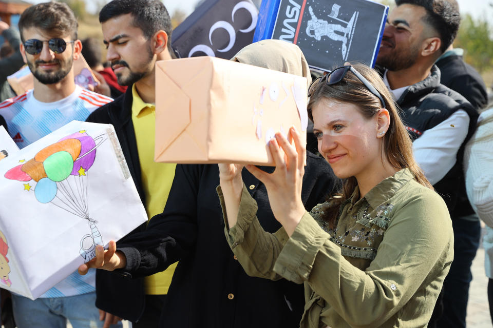 EDIRNE, TURKEY - OCTOBER 25: College students watch the solar eclipse with the 