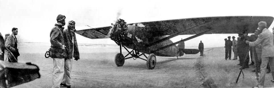 The "Pride of Detroit" airplane with the famous flying team of Ed Schlee and Bill Brick on Daytona Beach in November 1927. The team had previously attempted a flight around the world.