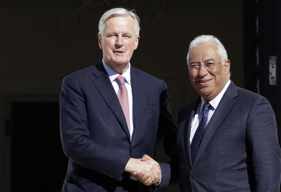 European Union chief Brexit negotiator Michel Barnier, left, and Portuguese Prime Minister Antonio Costa pose for the cameras before their talks at the Sao Bento palace in Lisbon, Thursday, Jan. 17 2019. Barnier says he hopes British Prime Minister Theresa May's consultations with national political leaders can help break the deadlock over the terms of the U.K.'s departure from the EU and herald "a new stage" in Brexit negotiations.(AP Photo/Armando Franca)