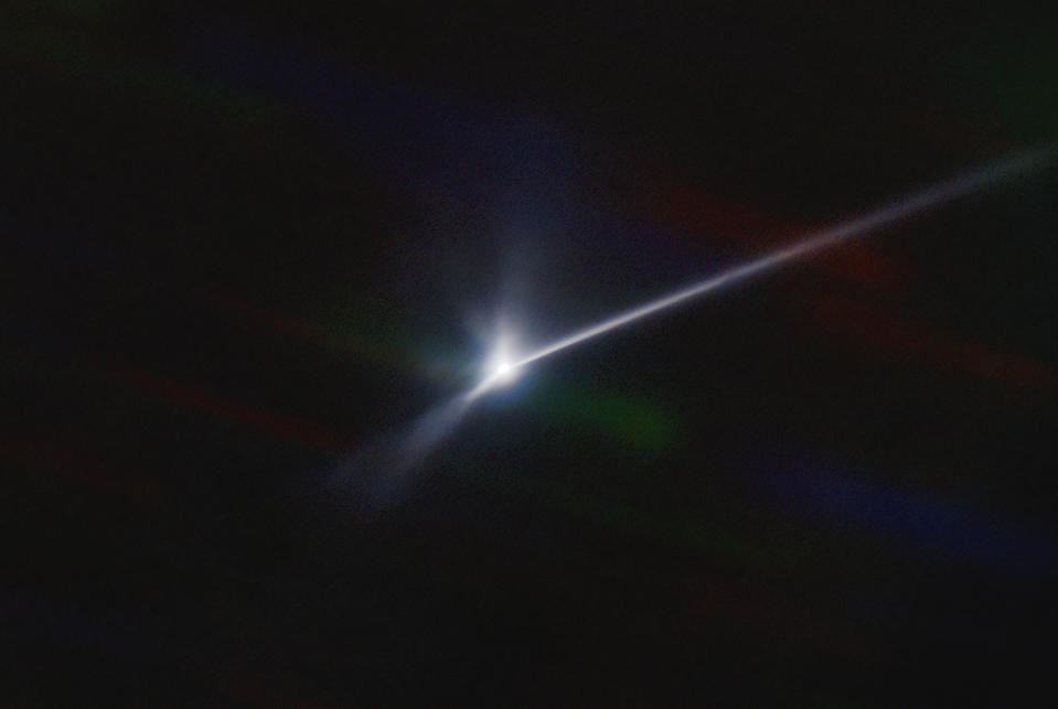 This image made available by NOIRLab shows a plume of dust and debris blasted from the surface of the asteroid Dimorphos by NASA's DART spacecraft after it impacted on Sept. 26, 2022, captured by the U.S. National Science Foundation's NOIRLab's SOAR telescope in Chile. The expanding, comet-like tail is more than 6,000 miles (10,000 kilometers) long. (Teddy Kareta, Matthew Knight/NOIRLab via AP)