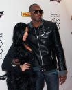 Kobe and his wife, Vanessa, pose for the cameras, with Kobe wearing a cool leather motorcycle jacket and sunglasses. (Photo: Getty Images)