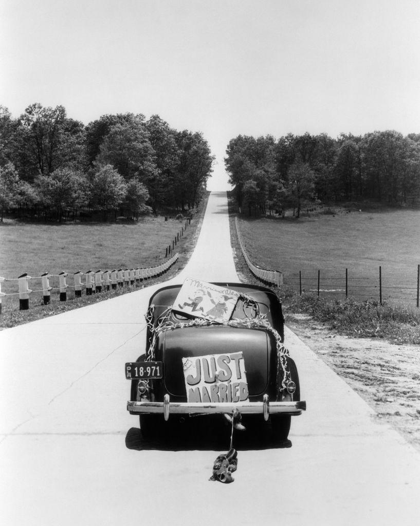 back view of vintage car with just married sign, black and white, that you might post in instagram with wedding vibes caption