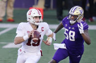 Washington linebacker Zion Tupuola-Fetui (58) pressures Stanford quarterback Davis Mills in the first half of an NCAA college football game Saturday, Dec. 5, 2020, in Seattle. (AP Photo/Elaine Thompson)