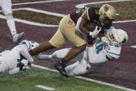 Texas State's Jahmyl Jeter (28) runs into the end zone against Coastal Carolina's Davon Bomar (48) during the second half of an NCAA college football game in San Marcos, Texas, Saturday, Nov. 28, 2020. (AP Photo/Chuck Burton)