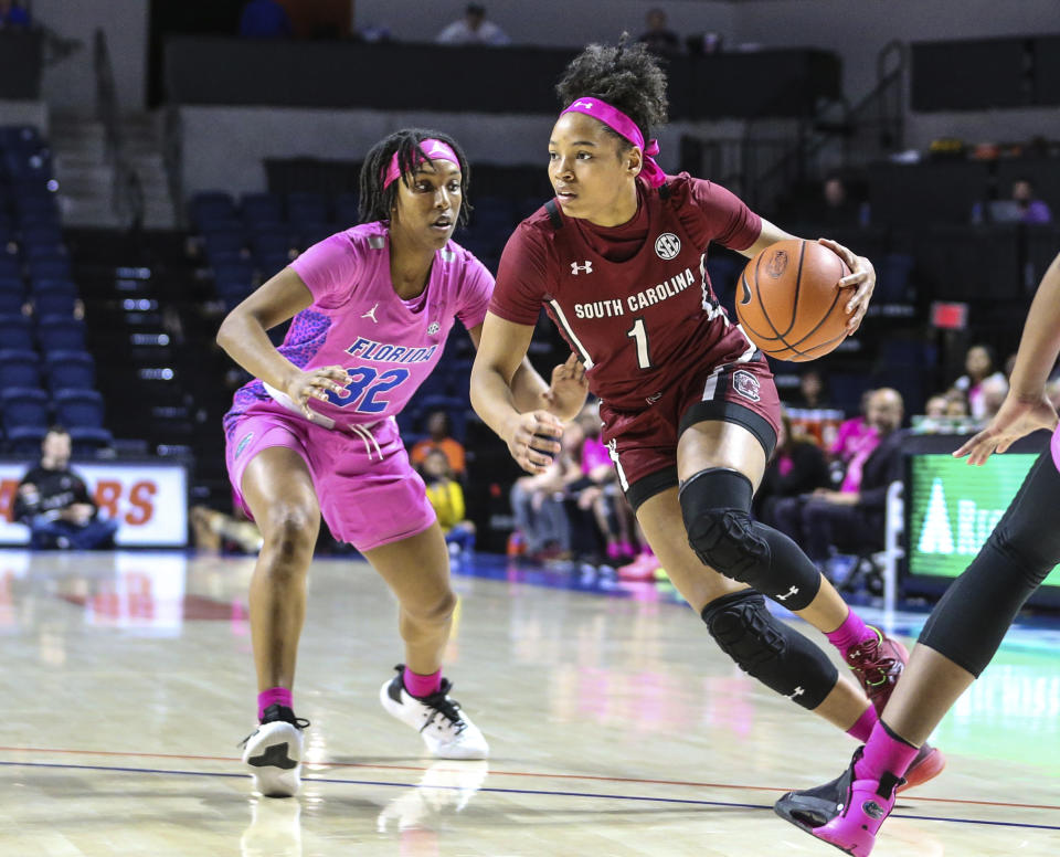 South Carolina guard Zia Cooke (1) drives to the basket past Florida guard Ariel Johnson (32) during the first half of an NCAA college basketball game Thursday, Feb. 27, 2020, in Gainesville, Fla. (AP Photo/Gary McCullough)