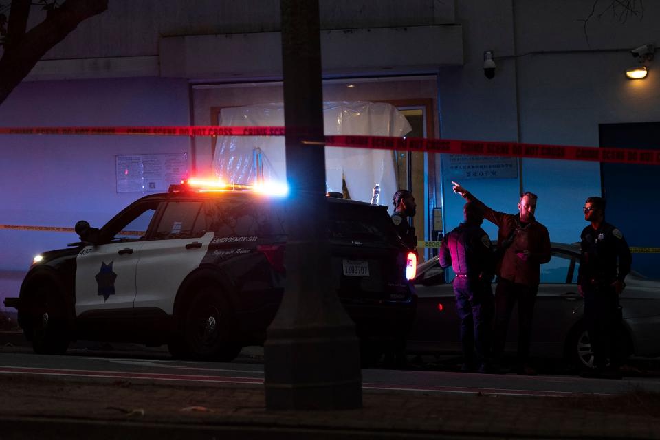 Police officers are seen outside the visa office of the Chinese consulate, where earlier a vehicle crashed into the building, in San Francisco, California, on October 9, 2023.
