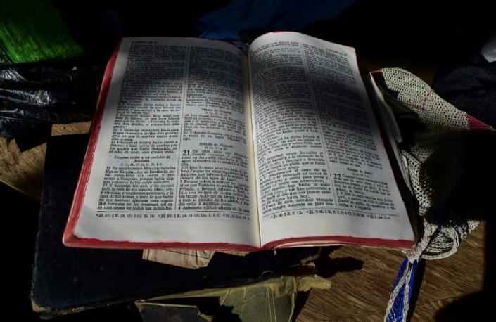 A bible and messages alluding to the devil can still be seen in the church where exorcism was carried out (AFP Photo/Luis ACOSTA)