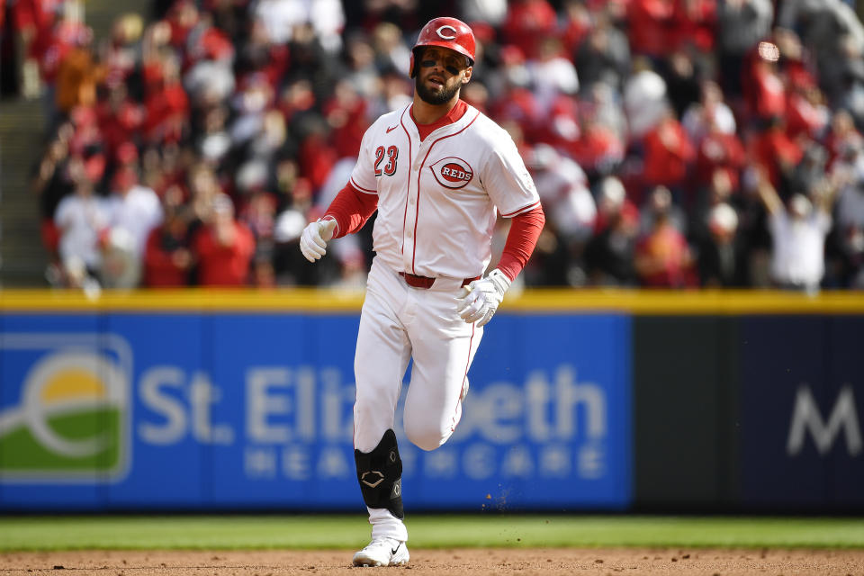 Cincinnati Reds' Nick Martini (23) rounds the bases after hitting a two-run home run during the second inning of an opening day baseball game against the Washington Nationals in Cincinnati, Thursday, March 28, 2024. (AP Photo/Timothy D. Easley)