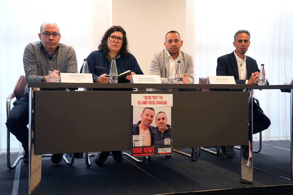 (Left-right) Stephen Brisley, Sharone Lifschitz, Sharon Sharabi and Raz Matalon who are family members of four people taken hostage by Hamas in Israel on 7 October, speak during a press conference (PA)