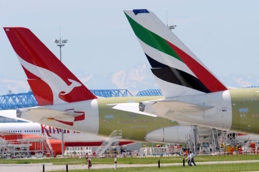 The tail sections of two A380 Airbus, Qantas and Emirates, pictured in 2009. Australia's Qantas Airways says it is in talks with carriers including Emirates to revive its international arm, an alliance that could see most of its London-bound flights routed through Dubai