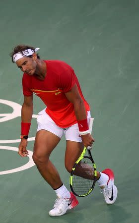 2016 Rio Olympics - Tennis - Semifinal - Men's Singles Semifinals - Olympic Tennis Centre - Rio de Janeiro, Brazil - 13/08/2016. Rafael Nadal (ESP) of Spain reacts during his match against Juan Martin Del Potro (ARG) of Argentina. REUTERS/Toby Melville