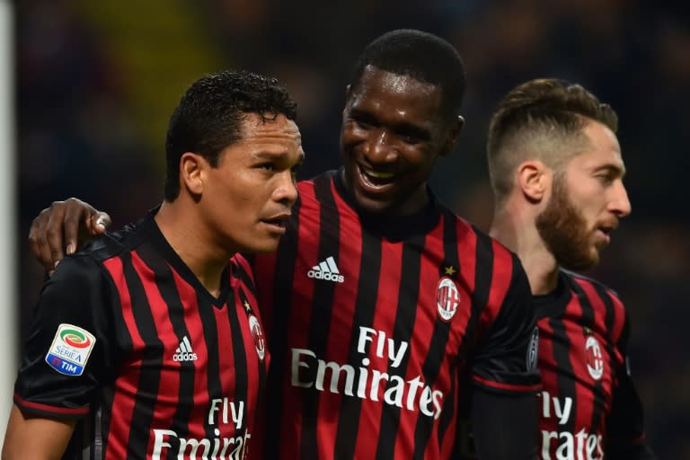 AC Milan's forward Carlos Bacca (L) celebrates with defender Cristian Zapata and midfielder Andrea Bertolacci (R) after scoring a goal during the Italian Serie A football match against Chievo March 4, 2017