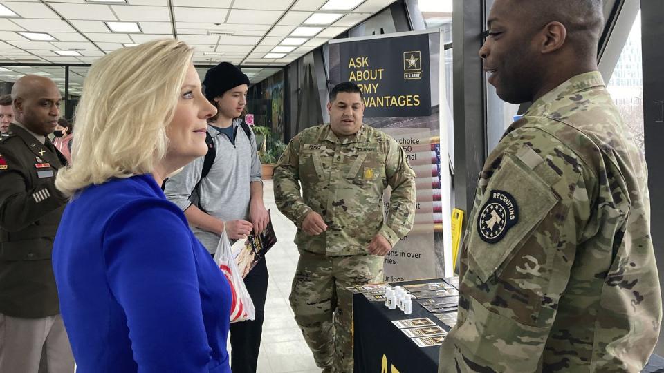 Army Secretary Christine Wormuth stops at an Army recruiting display after a speech to students at the Whitney M. Young Magnet High School in Chicago, on Feb. 14, 2023. (Lolita Baldor/AP)