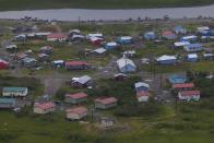 The village of Akiachak, Alaska, is visible from an airplane, Wednesday, Aug. 16, 2023. Akiachak is a Yup'ik village home to roughly 700 people based along the Kuskokwim River. (AP Photo/Tom Brenner)