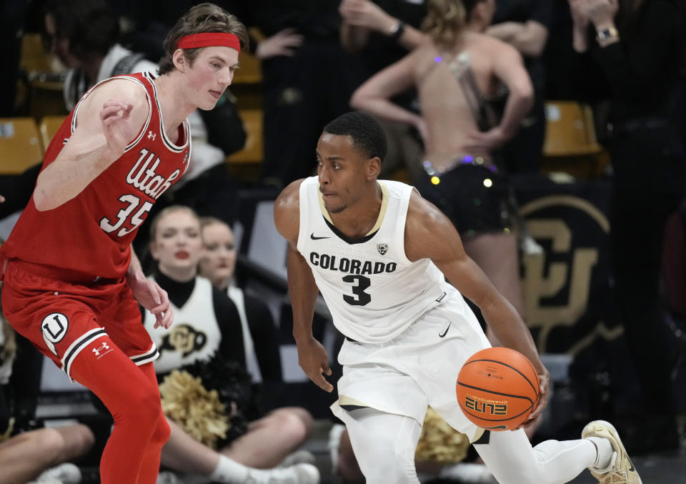 Colorado guard Jalen Gabbidon, right, drives to the rim as Utah center Branden Carlson defends in the first half of an NCAA college basketball game, Saturday, March 4, 2023, in Boulder, Colo. (AP Photo/David Zalubowski)