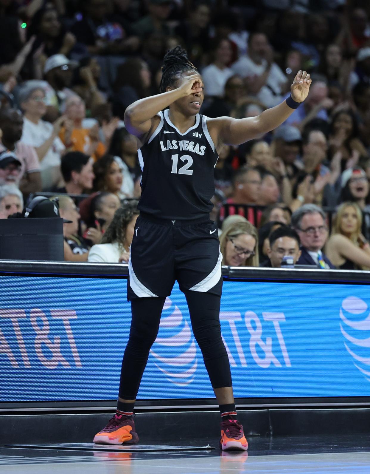 Chelsea Gray celebrates after Kiah Stokes scored in the Las Vegas Aces' game against the Connecticut Sun.