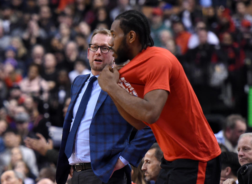 Feb 11, 2019; Toronto, Ontario, CAN;  Toronto Raptors head coach Nick Nurse speaks to forward Kawhi Leonard (2) as he prepares to enter the game against Brooklyn Nets in the second half at Scotiabank Arena. Mandatory Credit: Dan Hamilton-USA TODAY Sports