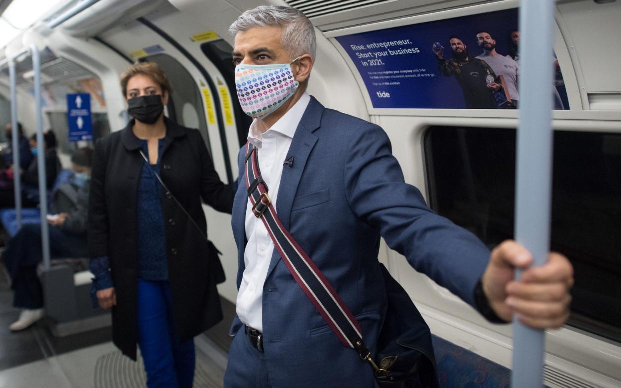 Sadiq Khan has asked Transport for London to retain face coverings as a mandatory measure after national guidance changes next Monday - Stefan Rousseau/ PA