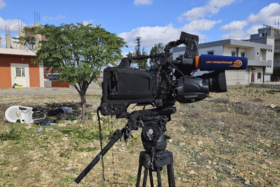 The damaged camera of pan-Arab TV network Al-Mayadeen cameraman Rabih Maamari, who was killed in an Israeli strike, is seen at the Lebanese border village of Tair Harfa near the border with Israel, Tuesday, Nov. 21, 2023. An Israeli strike on southern Lebanon killed Tuesday two journalists reporting for the Beirut-based Al-Mayadeen TV on the violence along the border with Israel, according to the Lebanese information minister and their TV station. (AP Photo/Mohammed Zinaty)