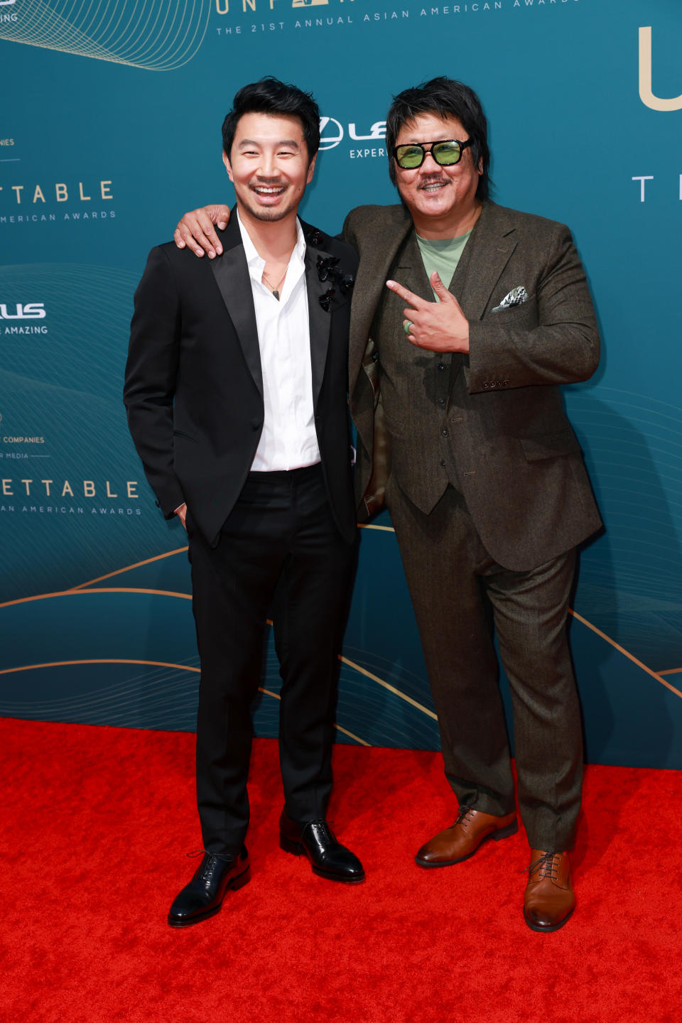 Simu Liu and Benedict Wong at the Unforgettable Gala held at the Beverly Hilton on December 16, 2023 in Beverly Hills, California.