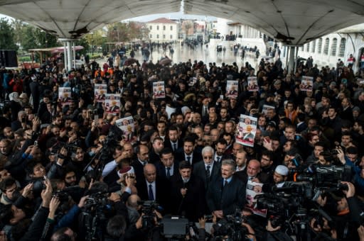 People gather for a symbolic funeral prayer for Jamal Khashoggi at the courtyard of Fatih mosque in Istanbul, on November 16, 2018