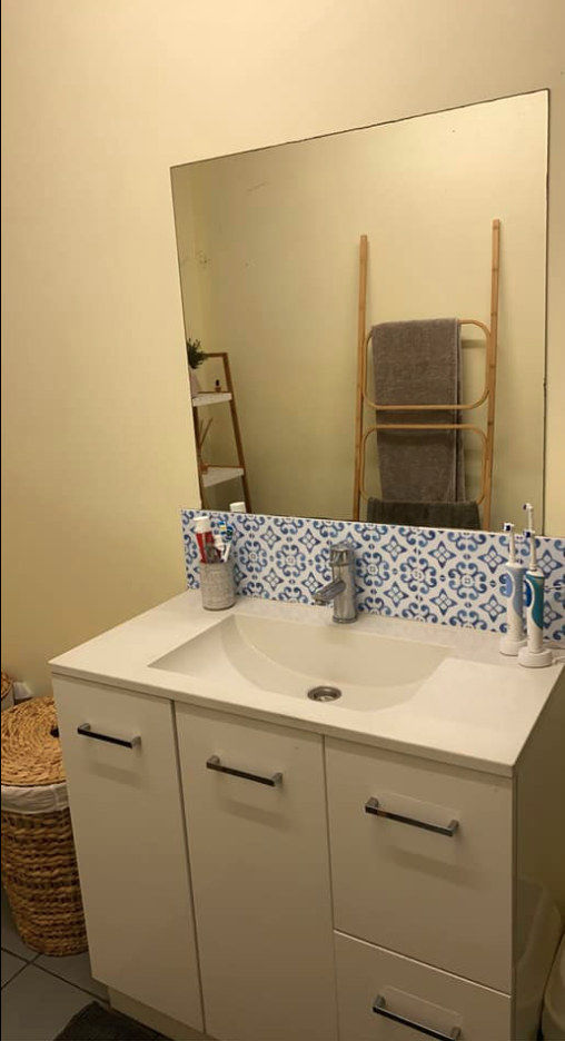 Woman's bathroom tile transformation 
