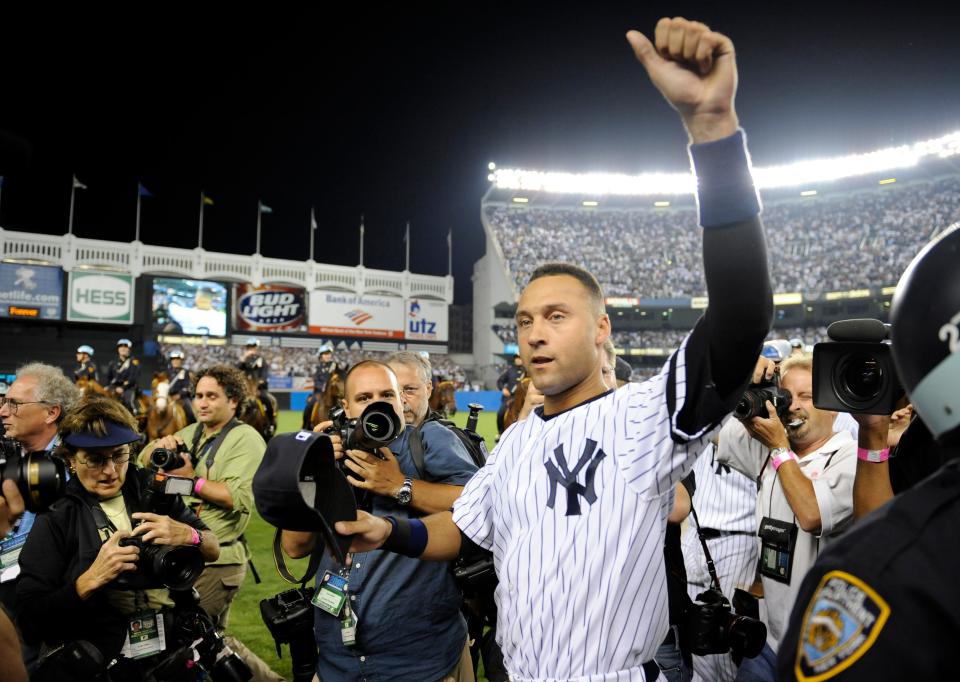 New York Yankees Derek Jeter acknowledges the crowd at Yankee Stadium in New York on Sunday, Sept. 21, 2008 after the Yankees played the Baltimore Orioles in the final regular season baseball game at the stadium.  (AP Photo/Ed Betz)