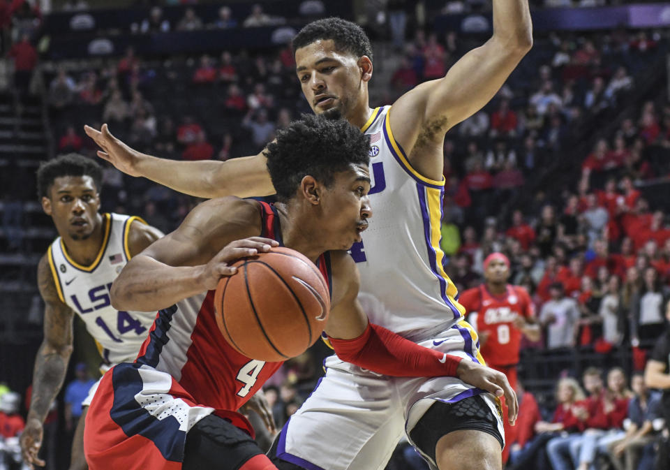 Mississippi guard Breein Tyree, front, drives against LSU guard Skylar Mays during an NCAA college basketball game in Oxford, Miss., Saturday, Jan. 18, 2020. (Bruce Newman/The Oxford Eagle via AP)