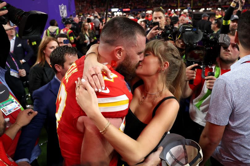 Travis Kelce #87 of the Kansas City Chiefs and Taylor Swift embrace after defeating the San Francisco 49ers in overtime during Super Bowl LVIII at Allegiant Stadium on February 11, 2024 in Las Vegas, Nevada