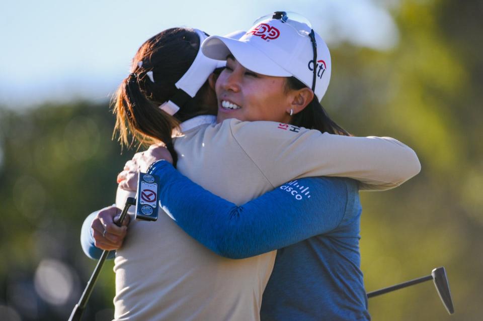 Danielle Kang, right, embraces winner Lydia Ko at the end of the final round of the Gainbridge LPGA Sunday at Boca Rio Golf Club.
