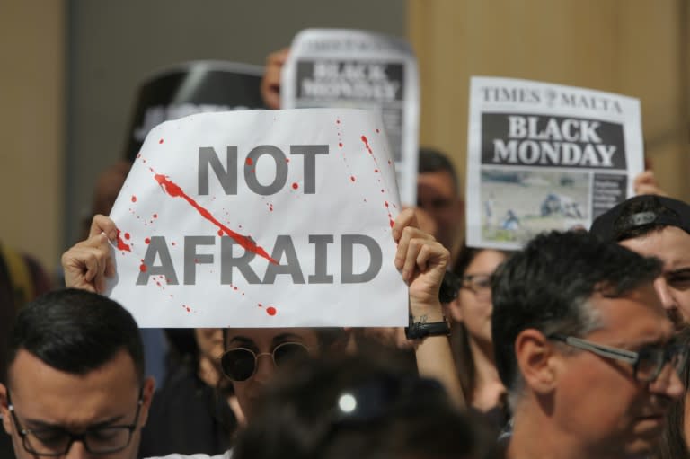 Maltese journalists rallied outside the parliament in Valletta, vowing they would not be intimidated by Caruana Galizia's murder in a car bomb attack