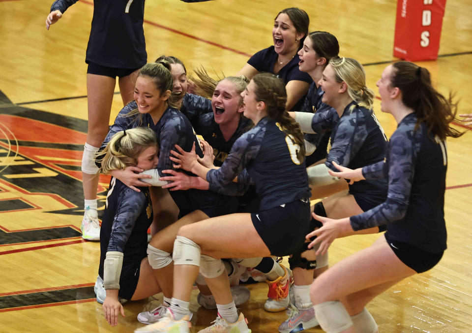 St. Ursula players celebrate after their win over Seton in there regional tournament volleyball game against Seton Thursday, Nov. 2, 2023.
