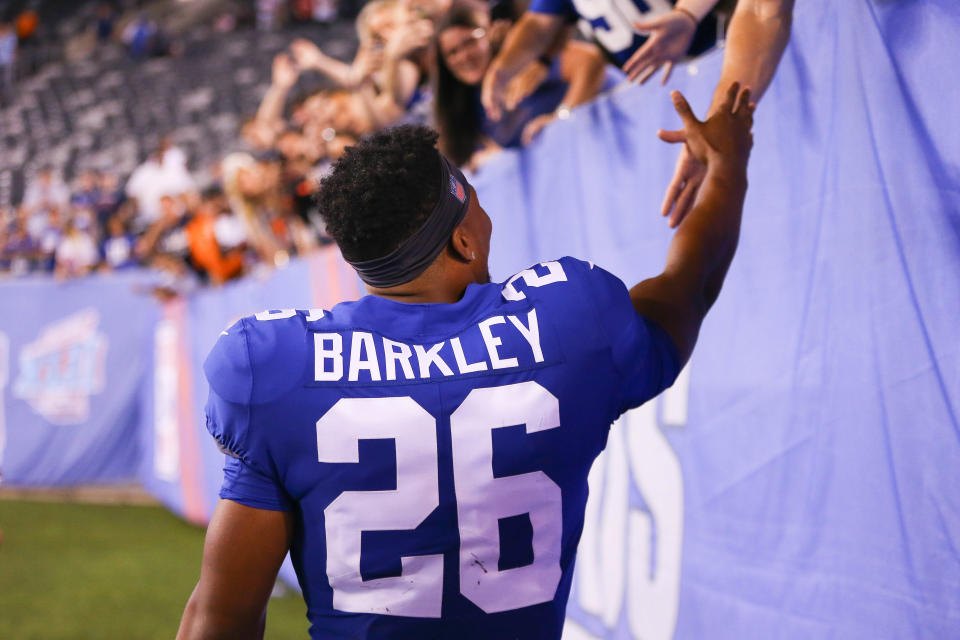 Aug 9, 2018; East Rutherford, NJ, USA; New York Giants running back Saquon Barkley (26) shakes hands with fans after his game against the Cleveland Browns at MetLife Stadium. Mandatory Credit: Vincent Carchietta-USA TODAY Sports