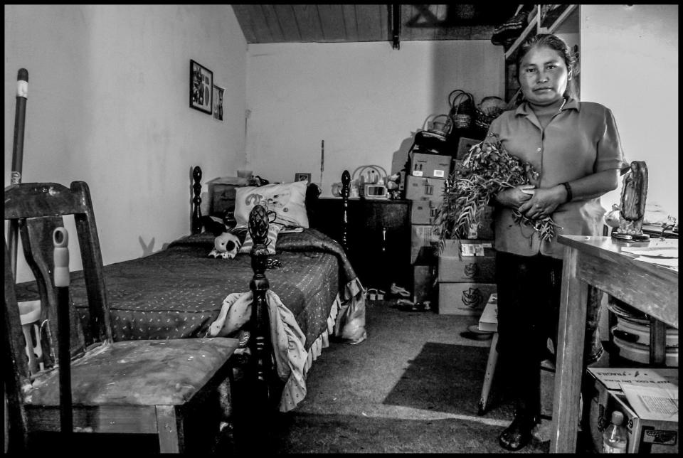 Gloria Merino, a Triqui woman, practices as a curandera, or traditional doctor, in her community.  She holds a bundle of the different herbs she uses in making remedies for various illnesses or problems.