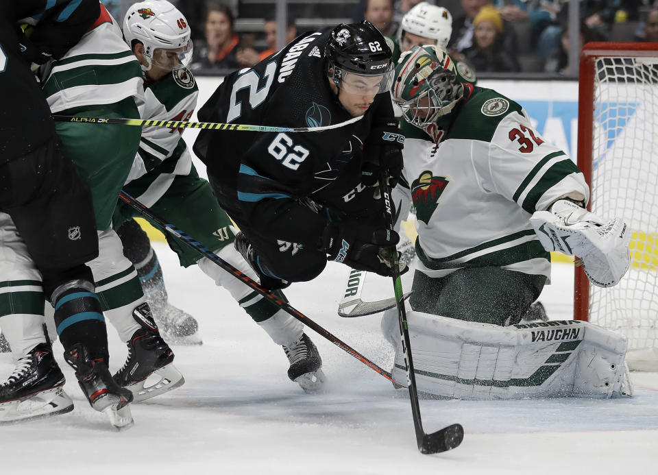 Minnesota Wild defenseman Jared Spurgeon (46) and goalie Alex Stalock, right, guard against San Jose Sharks' Kevin Labanc (62) in the third period of an NHL hockey game Thursday, March 5, 2020, in San Jose, Calif. (AP Photo/Ben Margot)