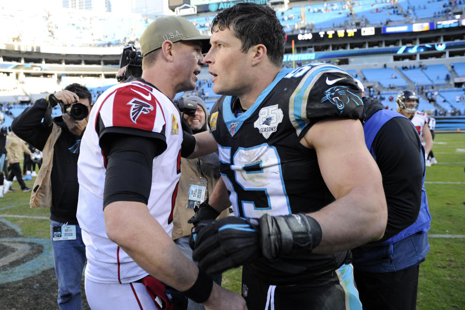 Atlanta Falcons quarterback Matt Ryan, left, and Carolina Panthers middle linebacker Luke Kuechly (59) speak following an NFL football game in Charlotte, N.C., Sunday, Nov. 17, 2019. (AP Photo/Mike McCarn)