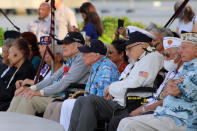 Pearl Harbor survivors and other military veterans observe a ceremony on Wednesday, Dec. 7, 2022, in Pearl Harbor, Hawaii in remembrance of those killed in the 1941 attack. A handful of centenarian survivors of the attack on Pearl Harbor gathered at the scene of the Japanese bombing on Wednesday to commemorate those who perished 81 years ago. (AP Photo/Audrey McAvoy)