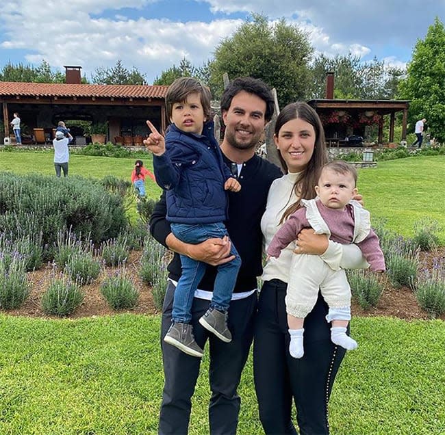 Sergio Perez and wife holding children