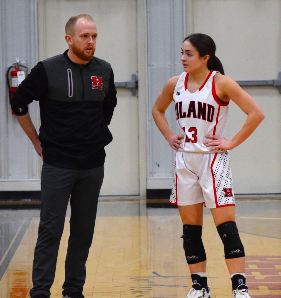 Hiland coach Brady Schlabach talks strategy with point guard Ashley Mullet. The Hawks will pace a pair of Division I powerhouses in Reynoldsburg and Olmsted Falls in the Classic in the Country, Saturday, Sunday and Monday at the Perry Reese Jr. Community Center at Hiland.