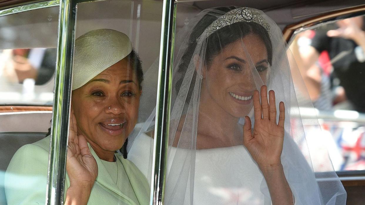 topshot meghan markle r and her mother, doria ragland, arrive for her wedding ceremony to marry britains prince harry, duke of sussex, at st georges chapel, windsor castle, in windsor, on may 19, 2018 photo by oli scarff afp photo credit should read oli scarffafp via getty images