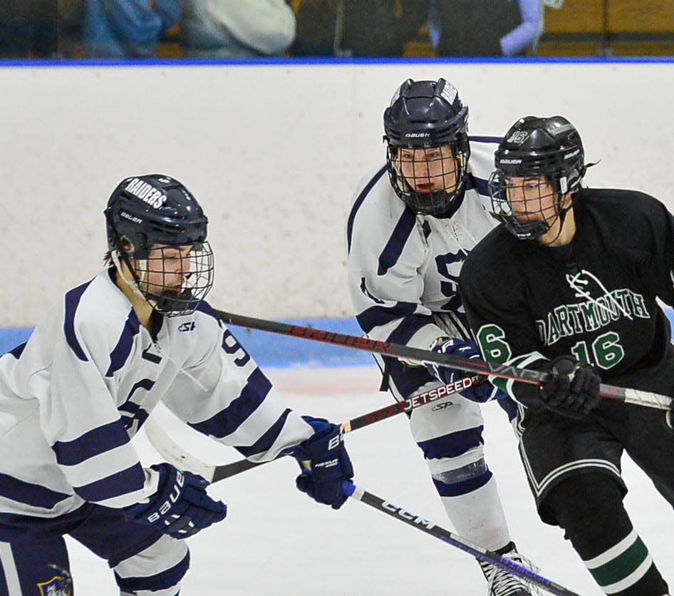 Somerset Berkley’s Noah Taylor gets a stick to the face from Dartmouth’s Charlie Camisa.