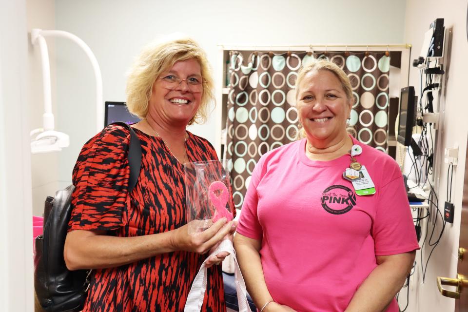 Melissa Ray gets her cookie and gift bag from Malissa Kennedy, Ambulatory Services Manager Telfair Pavilion and Mobile Mammography, after getting her mammogram at the Telfair Pavilion.